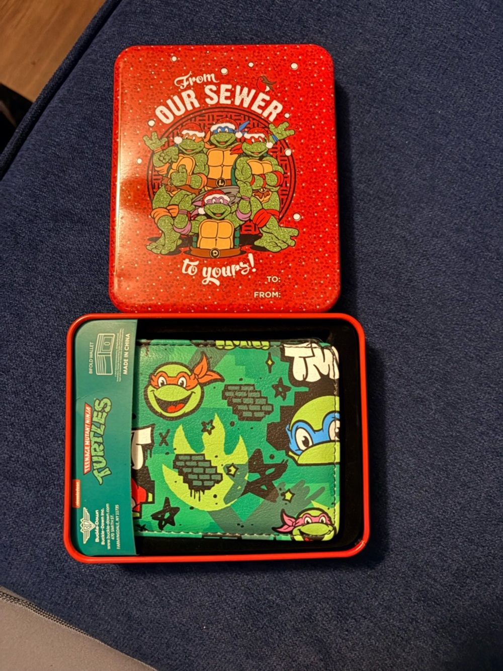 Teenage Mutant Ninja Turtles "Faces Brick Wall" bifold wallet by Buckle-Down